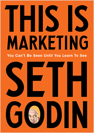 To je posnetek zaslona naslovnice knjige This Is Marketing avtorja Seth Godin. Naslovnica je navpični pravokotnik z oranžnim ozadjem in črnim besedilom. Fotografija Osenove glave se pojavi v O njegovega priimka.